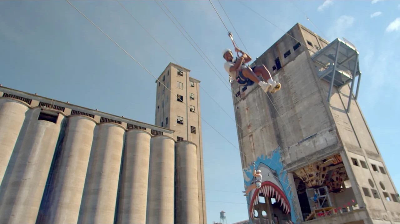 Someone riding the zipline at the Buffalo, NY Riverworks