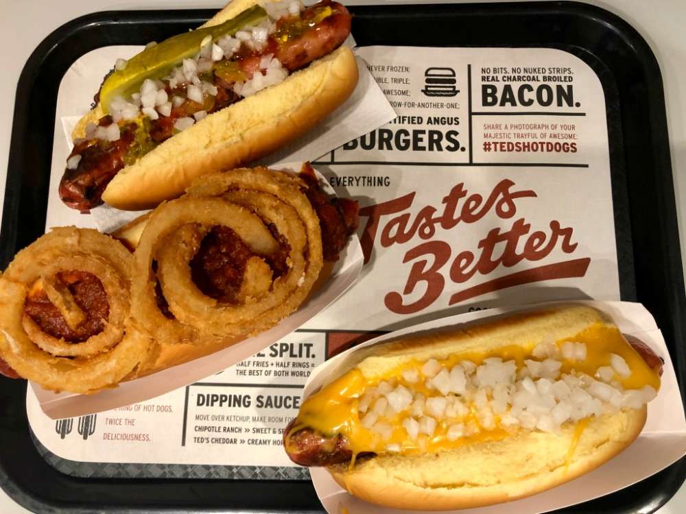 A tray of hot dogs and onion rings at Ted's Hot Dogs in Buffalo, NY